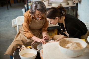 Master and elderly student chat during training