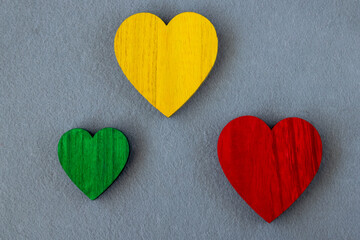 Fototapeta premium Traffic light green, yellow, red hearts on the gray background.