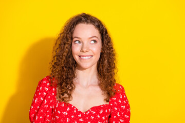 Photo of cheerful dreamy lady dressed red blouse biting lip looking empty space isolated yellow...