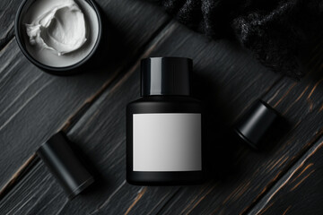 bottle of black beauty product with white label on black background