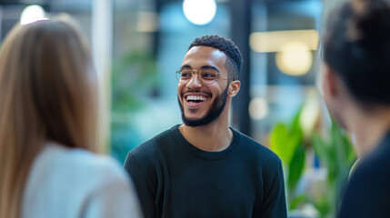 A vibrant team debating a decision in an open office space, laughing and smiling as they exchange ideas. The blurred background of office desks and windows adds to the modern and optimistic ambiance.