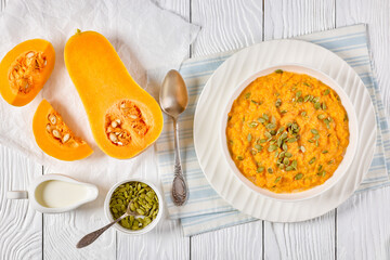 butternut squash puree with pumpkin seeds in bowl
