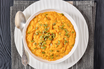 butternut squash puree with pumpkin seeds in bowl