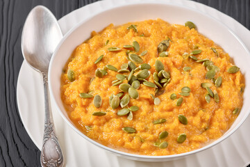 butternut squash puree with pumpkin seeds in bowl