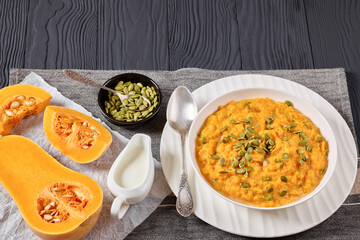 butternut squash puree with pumpkin seeds in bowl