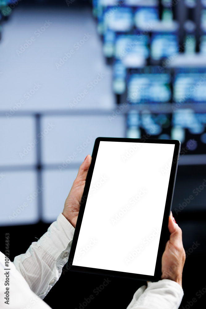 Poster close up shot of mock up tablet used by experienced serviceman in data center using server cabinets 