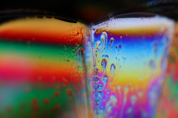 Bright reflection of liquid in macro, blue and silver colors, rainbow background, Blue bubbles in macro, connection of bubbles in macro, cell from liquid, molecules connection, ultra macro