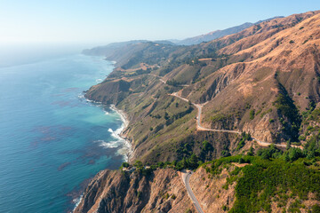 Beautiful landscape of Pacific Ocean coast along Highway 1 and Big Sur, aerial view, sunset, sunrise, fog. Concept, travel, vacation, weekend