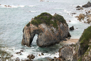 Horsehead Rock at Wallaga Lake on the south coast of New South Wales Australia. A rock formation on the coast that looks like a horse drinking