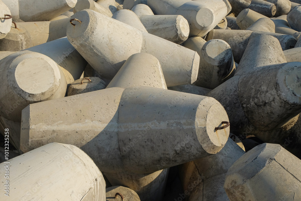 Poster concrete wave breakers on the beach with abstract shapes, patterns and textures. wave breakers to pr