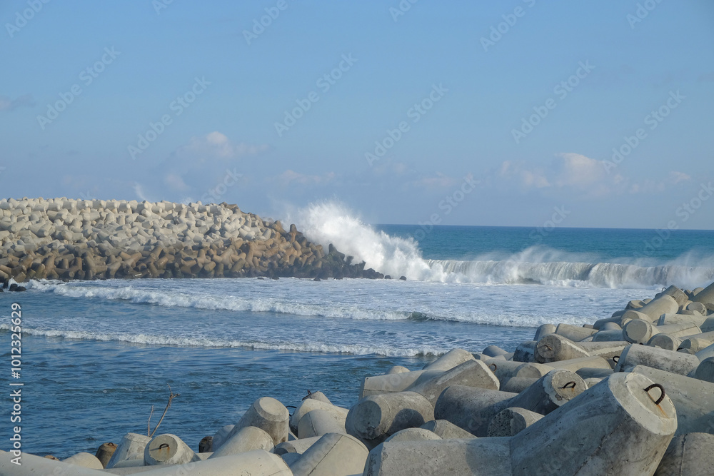 Aufkleber concrete wave breakers on the beach with abstract shapes, patterns and textures. wave breakers to pr