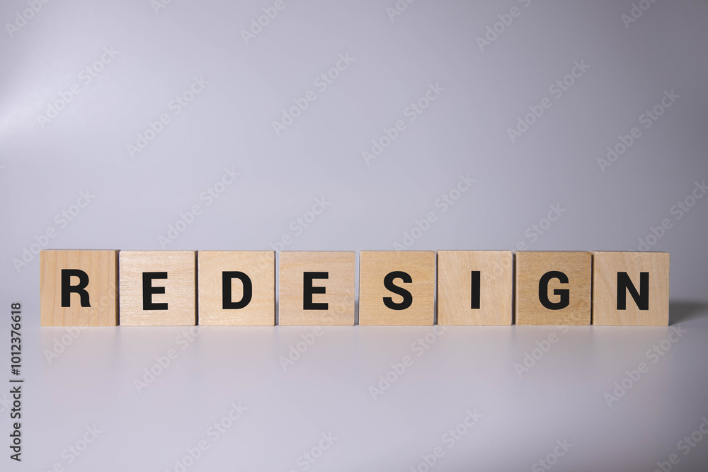 Poster redesign word made with building blocks on light background