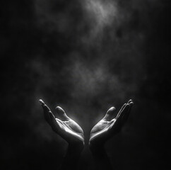 image features two open hands reaching upwards, surrounded by dark, smoky background, evoking sense of hope and yearning