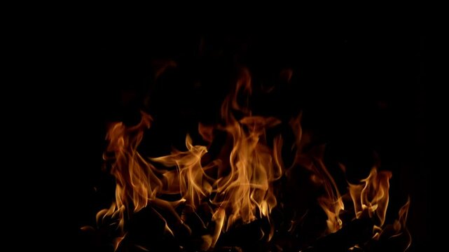 Fire burn in fireplace. Burning flame. Blaze fire flame on black. Burning overlay design. Blaze flames overlay background. Burning fire. Stove firebox. Slow motion cinema camera, 1000 fps.