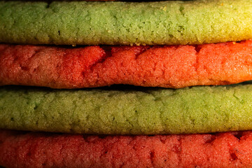 Macro close-up of layered green and red Christmas cookies