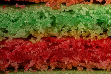 Macro close-up of layered green and red Christmas cookies filling