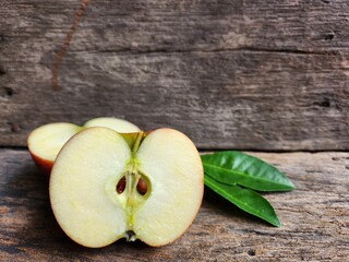Ripe apple on wood background