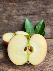 Ripe apple on wood background