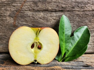 Ripe apple on wood background
