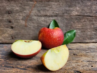 Ripe apple on wood background