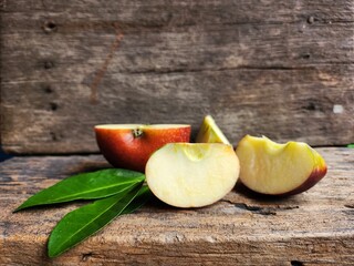 Ripe apple on wood background