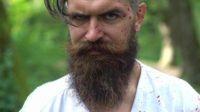 Halloween. zombie man. Creepy man with bloody scars Halloween close up face. Man zombie with blood on face. Creative art make-up for Halloween. Man face Scary zombie. Halloween party.