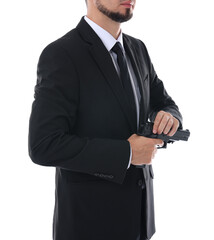 Young bodyguard in suit with gun isolated on white, closeup
