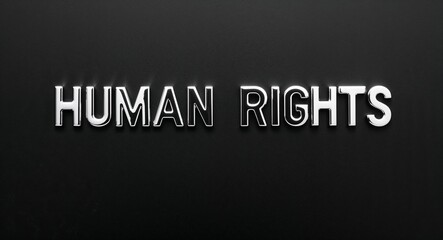 human rights silver shining shiny solid metallic lettering on plain black background