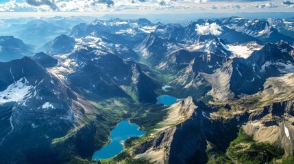 Fototapeta premium Aerial View of Majestic Mountains and Turquoise Lakes in a Remote Wilderness