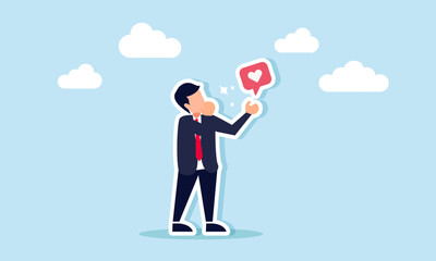 A businessman is showing a shiny heart symbol, illustrating appreciation for the performance of the team.