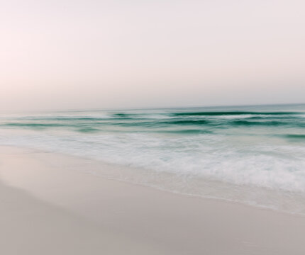 ocean waves and beach at sunrise in Seaside, Florida