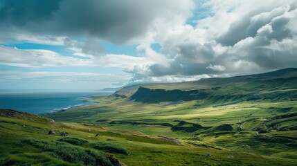 Naklejka premium Scenic View of Rolling Green Hills and Blue Ocean
