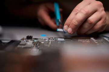Hand Repairing a Graphics Card through the Application of Thermal Paste for Better Performance