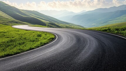 Naklejka premium An asphalt road curving gently through green mountain slopes, under a bright sky with light, wispy clouds.