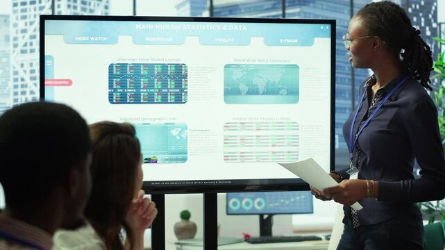 Accounting manager reviewing budget numbers after all monthly costs, working on a financial projection to deduct the future enterprise situation. Presenting infographics during a meeting. Camera A.