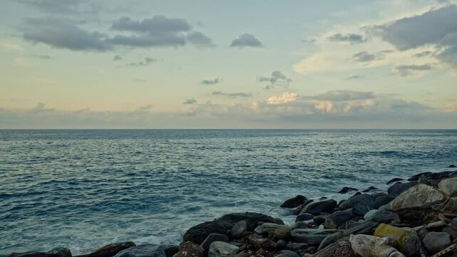Slow motion of waves breaking on the rocks on a tropical beach at sunset. Macuto Coast, Venezuela.