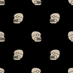 Seamless monochrome pattern with stylized human skulls. Native American design of Aztec Indians. Skeleton head. White silhouettes on black background.