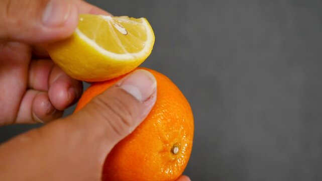 Citrus fruits orange and fresh lemon on grey background, closeup