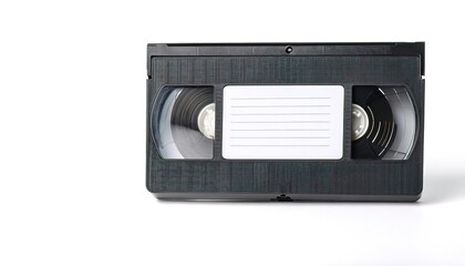 Obraz premium blank VHS - Video Home System - analog video recording on tape cassette. also made in Beta Max version. played on a VCR video recorder. Blank white label isolated on white background with copy space