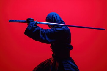 Kendo athlete in black uniform training in neon lit studio