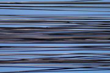 Overhead wiring On blue sky background