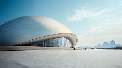 Obraz premium Modern Architecture: A Curved Structure with a Glass Facade