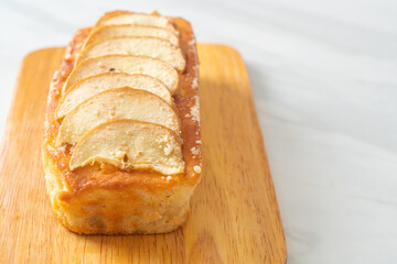 apple loaf crumbled on wood board