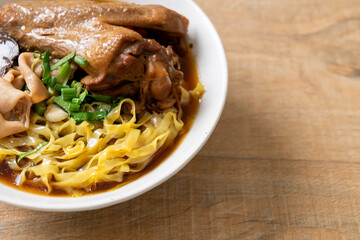 egg noodles with stewed and braised duck in brown soup