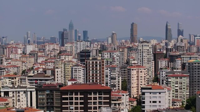 Aerial Boom Shot Above Kadikoy Neighbourhood. Istanbul Skyscrapers in Background
