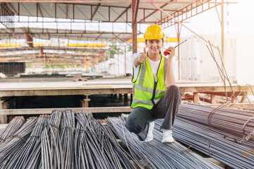 Engineer worker, Officer working check steel bar strength grade for high quality products and standard in construction site.