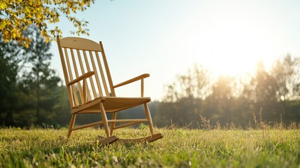 Fototapeta premium A rustic wooden rocking chair stands serenely in a grassy field, bathed in the warm glow of the setting sun, symbolizing relaxation, tranquility, and nature's embrace.