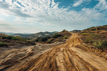 Fototapeta premium Muddy terrain with steep hills for motocross and extreme sports