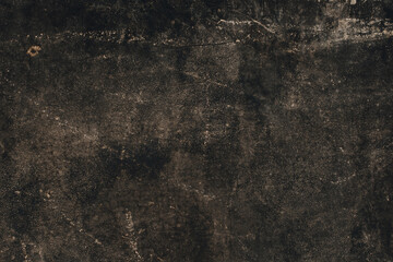 The background is made of an old worn, gray-black surface