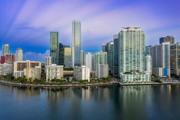 Naklejka premium Downtown waterfront with buildings and condos at sunrise. Miami, Florida, United States.